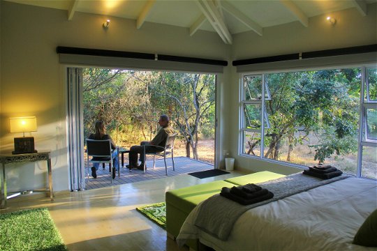 Green Bed View with guests outside, Green Monkey Orange, Boutique, Bushwillow  Collection 