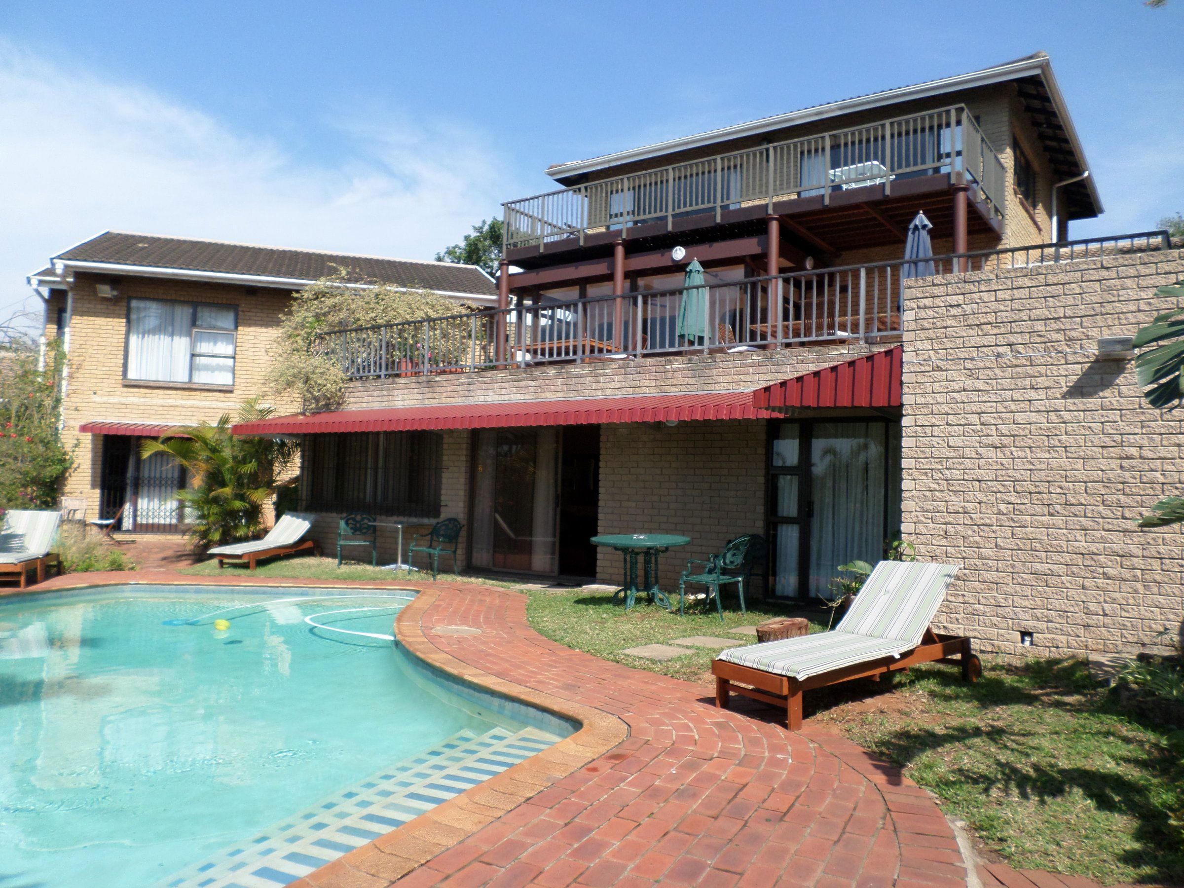 Guesthouse from pool, Kingston Place Guesthouse