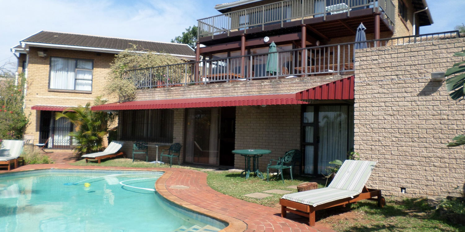 Guesthouse from pool, Kingston Place Guesthouse