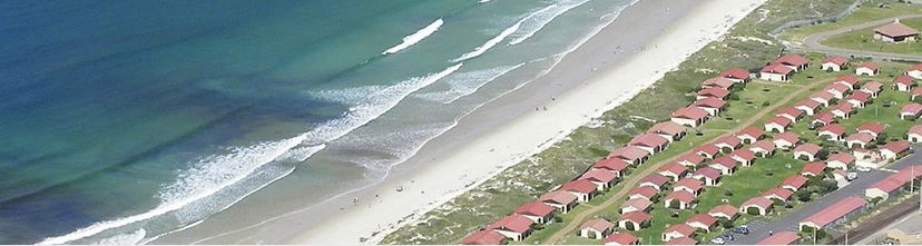 Aerial view of Seaside Cottages on Fish Hoek Beach