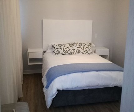 Second bedroom with double bed of Cottage 65 at Seaside Cottages Fish Hoek