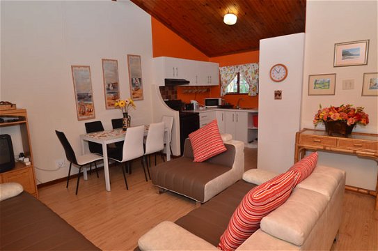 Lounge and dining area of Cottage 57, Seaside Cottages Fish Hoek