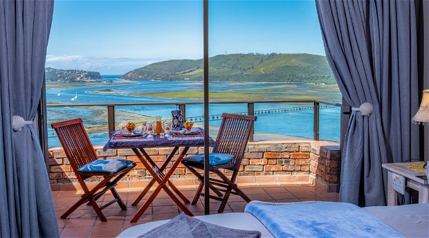 Actual view from the Bed and breakfast bedroom over the Knysna lagoon, harbor and Knysna Heads