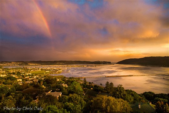 Knysna Lagoon, Sunset with rainbow.   Actual view from Paradise Found. Photo by Chris Daly.