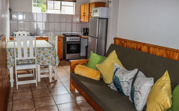 Chalet 9, self-catering chalet for max two adults and two children, one bedroom, one bathroom with bath.