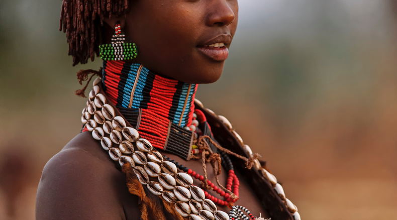 Omo Valley girl with traditional costume. Omo Valley girl with traditional costume.