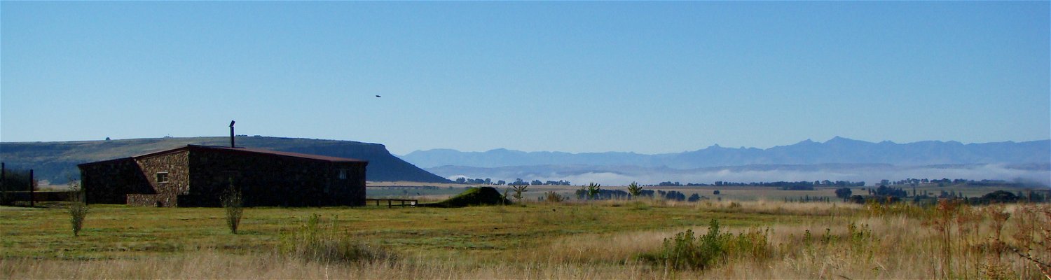 The magnificent view of the Maluti Mountains with Guinea Fowl and Mongoose Cottages in the foreground at Amohela ho Spitskop Country Retreat & Conservancy between Ficksburg & Clocolan in the Eastern Free State