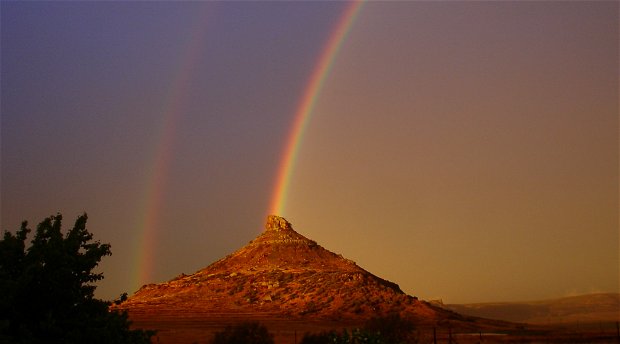 A double rainbow over Spitskop Mountain, at Amohela ho Spitskop Country Retreat & Conservancy on the border  of Ficksburg & Clocolan Free State.