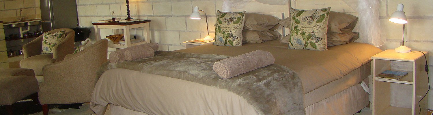 The beautiful king size bed with heated blankets and bi cuddly duvets in Quail Self Catering Cottage, one of the SkyWind Cottages at Amohela ho Spitskop Country Retreat Between Ficksburg and Clocolan Free State