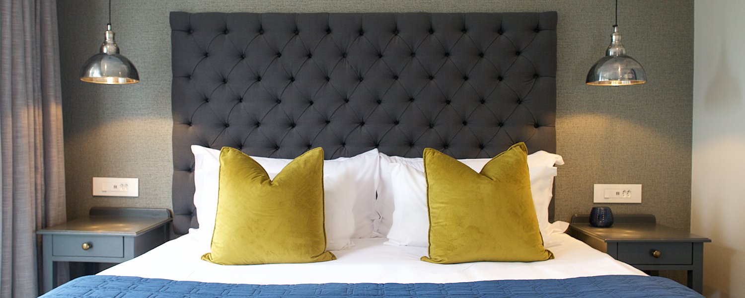 Button headboard, Chartreuse pillows, modern bedroom, grey interiors