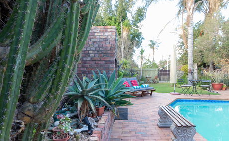 Outdoor swimming pool, garden and sun terrace