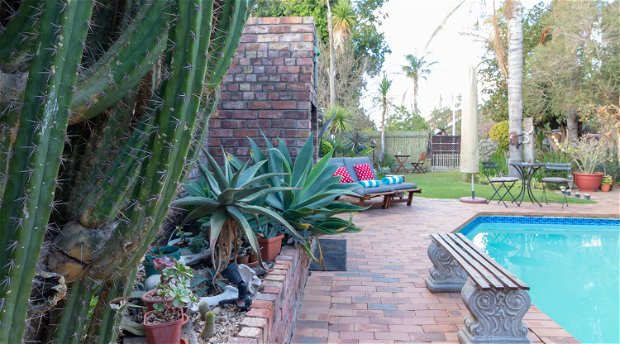 Outdoor swimming pool, garden and sun terrace