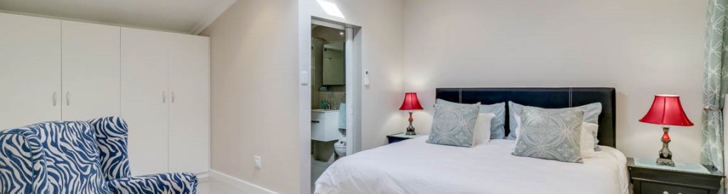 The master bedroom offers a king sized bed, hairdryer, safe and en suite bathroom.