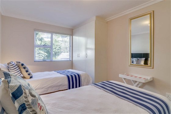 The second bedroom offers a wardrobe with views of the Twelve Apostles Mountain Range.