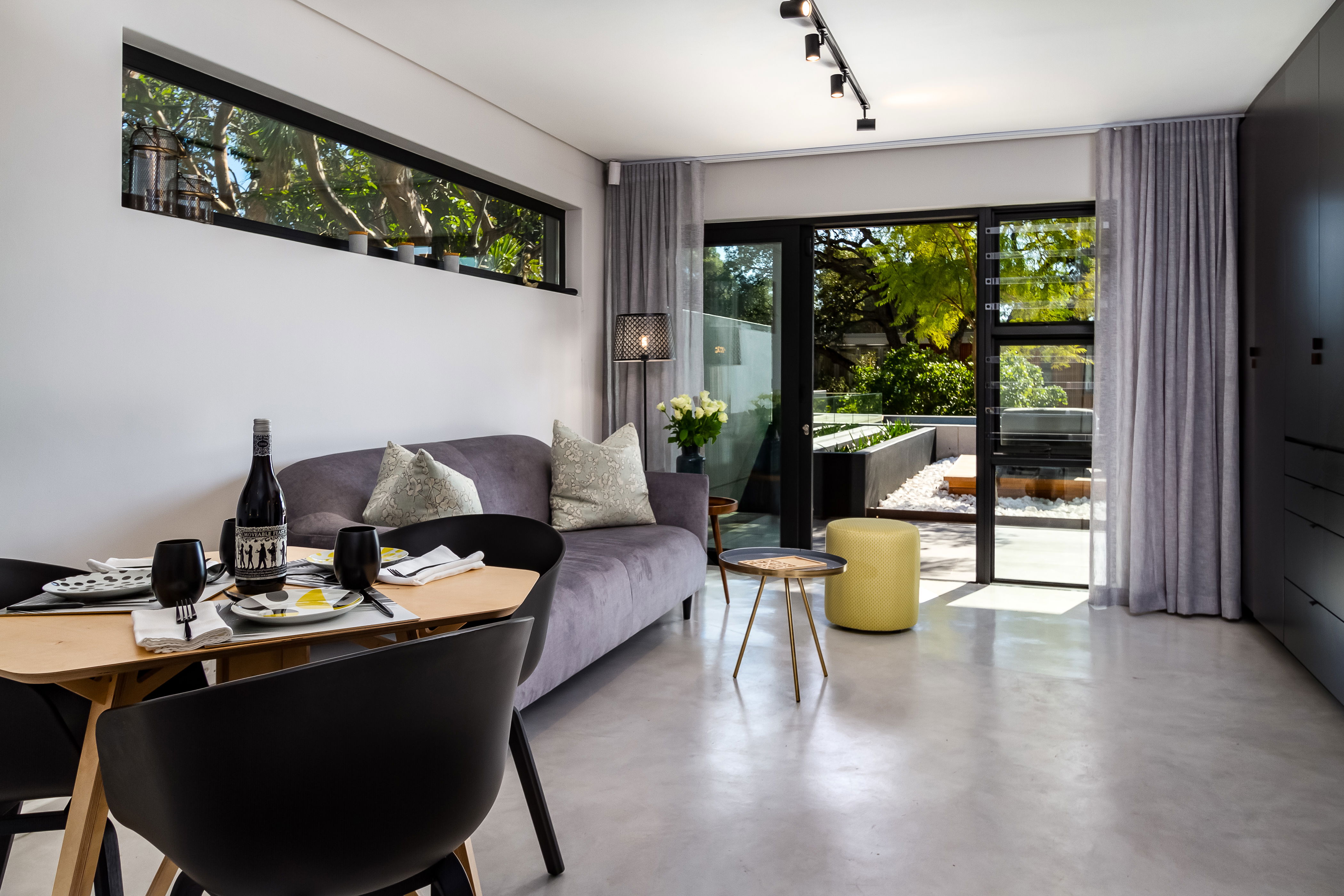 Open plan living area leading onto shared patio