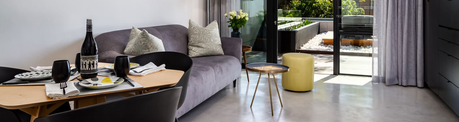 Open plan living area leading onto shared patio