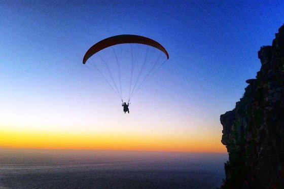 Paragliding off Lion's Head in Camps Bay