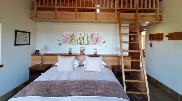 King size bed and two single beds on the loft