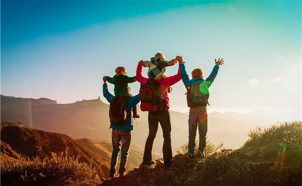 Family adventure: a family hiking together Family adventure: a family hiking together