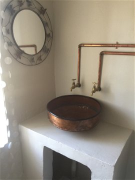 Bathroom with copper basin in Lara's Roodepoort Farm , Clarens