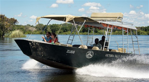Boating on the zambezi river Zambia by Limbo Lodge.