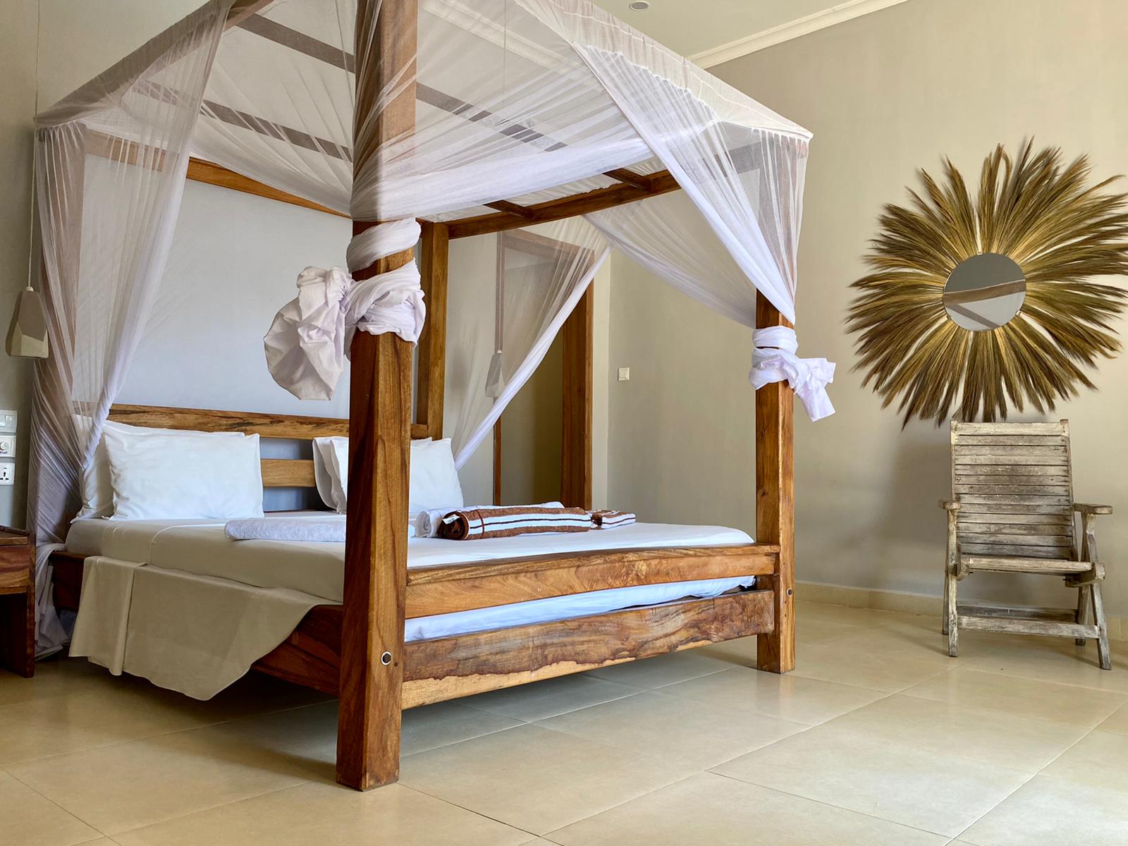 Deluxe double room bedroom Paje
