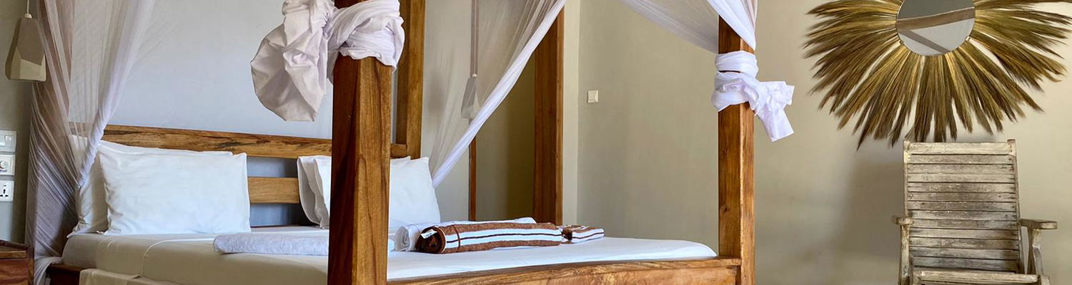 Deluxe double room bedroom Paje