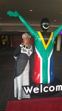 Thamendrie at the entrance of ICC 2018 Indaba 