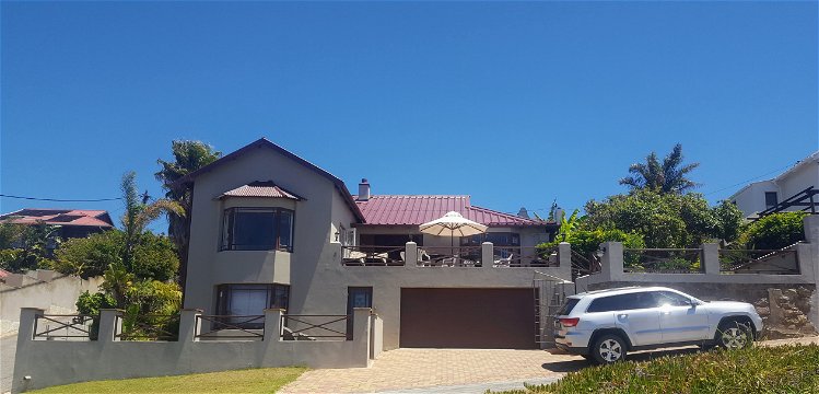 Front view of Admirals Rest Self-catering house in Mossel Bay.  Above the double garage is the deck from where you can sit and relax.