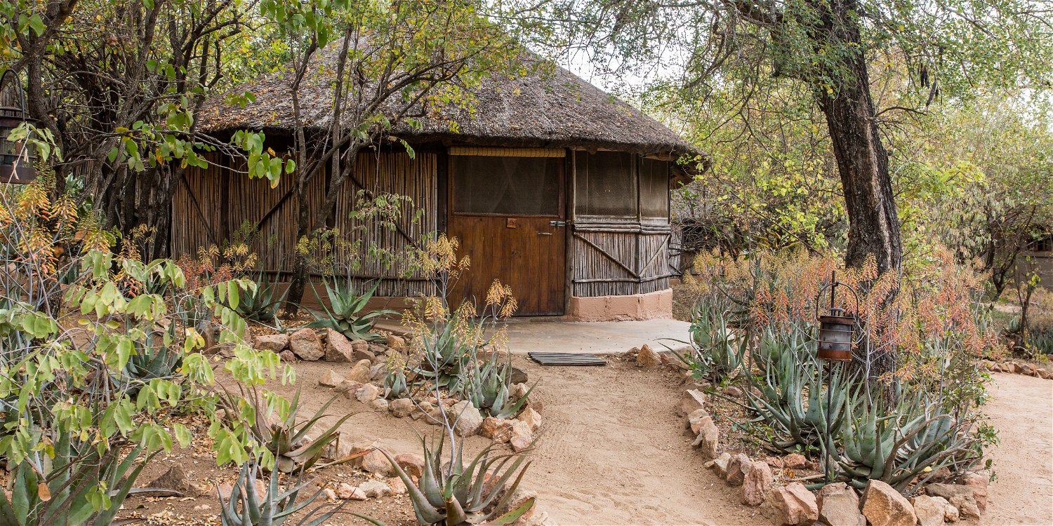 Family Reed and thatch hut at umlani bushcamp, situated in the timbavati private nature reserve in beauitful affordable south africa, the lowveld specifically