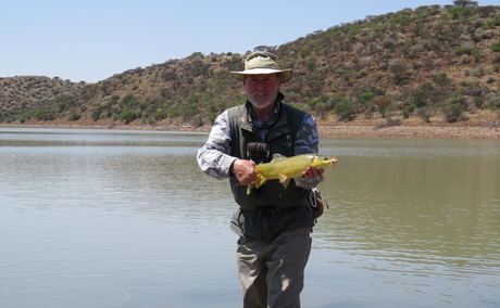 Alan Hobson with a smallmouth yellowfish, Wild Fly Fishing in the Karoo Alan Hobson with a smallmouth yellowfish, Wild Fly Fishing in the Karoo