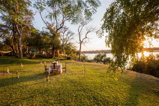 Dine on the banks of the Zambezi near Victoria Falls