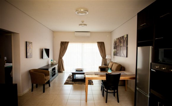 Apartments @ 125 - 1 bedroom unit; lounge & dining area, including smart enabled TV
