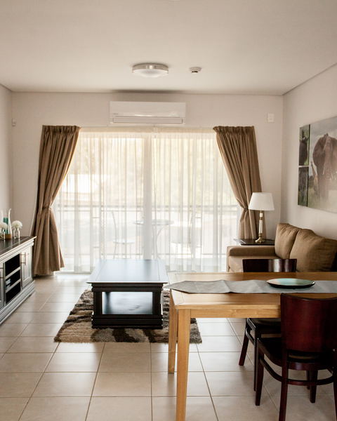 Apartments @ 125 - 1 bedroom unit; lounge & dining area including smart enabled TV