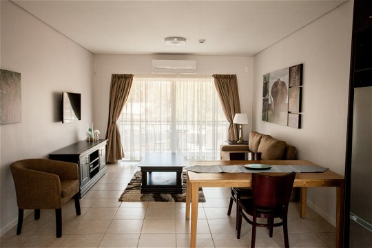 Apartments @ 125 - 1 bedroom unit; lounge & dining area including smart enabled TV