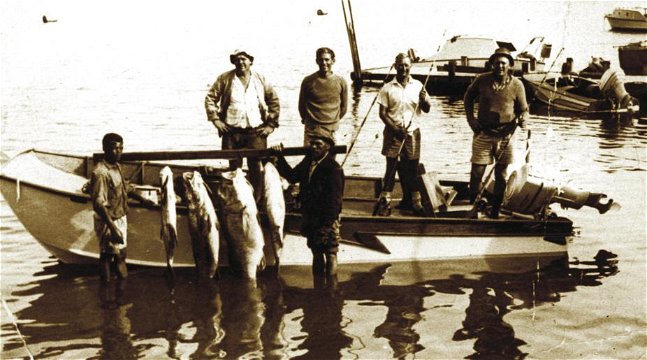 Back row left to right: Barny Barnard, Dr Chris Barnard, Hentie van Rooyen, Dr Andries van Zyl. Front: Andries ? and Mr. Grootboom with the day's catch