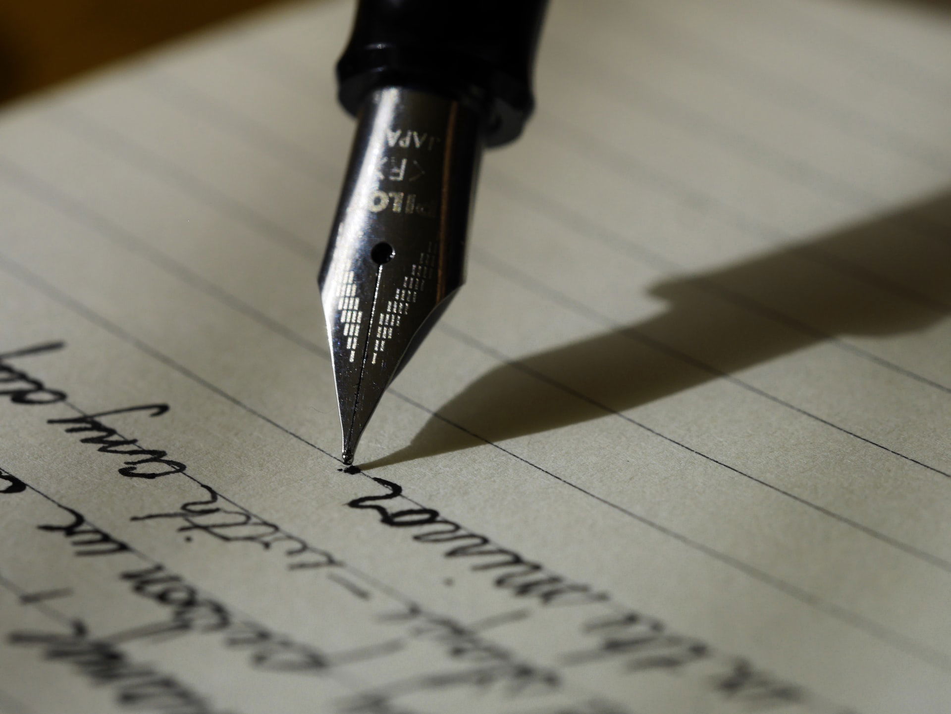 Writing. Photo by Aaron Burden via Unsplash https://unsplash.com/@aaronburden