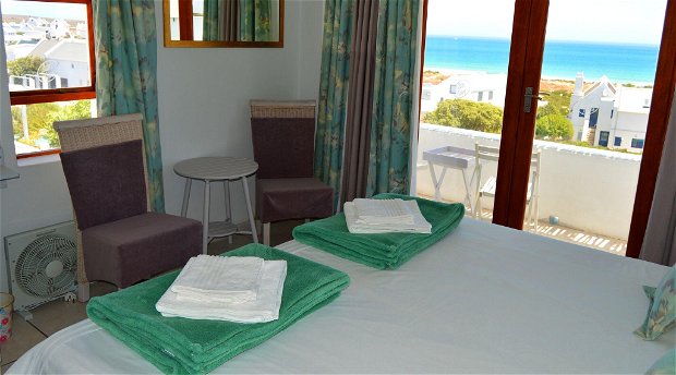 The Self Cater main bedroom with its balcony and panoramic sea view