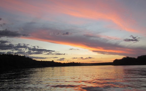 A sunset is always iconic on the Zambezi River in Zimbabwe and marks that time of the day when humans and animals can rest from the hot african sun. At Sundowner Zambezi Lodge this is the perfect time to relax and reflect on the beauty of the incredible area which savouring and ice cold refreshment.