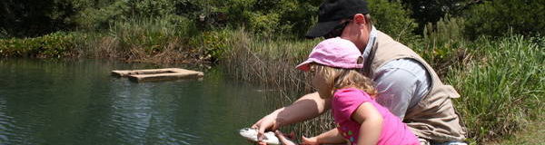 Dads and daughter fishing together on Fathers Day