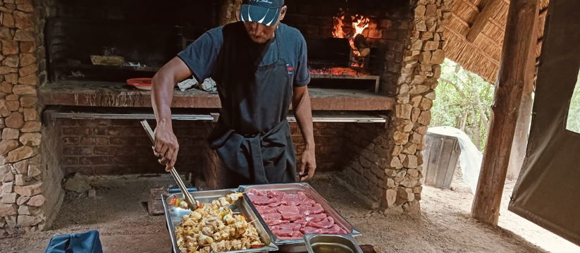 A sizzling braai in action—perfectly grilled meat over open flames, bringing authentic South African flavors to life.