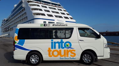A tour vehcile photographed near a cruise ship that arrived at Port Elizabeth Cruise Terminal to pick up cruise ship passengers to go on a guided shore excursion in Port of Cape Town and Port Elizabeth Harbour
