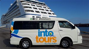A tour vehcile photographed near a cruise ship that arrived at Port Elizabeth Cruise Terminal to pick up cruise ship passengers to go on a guided shore excursion in Port of Cape Town and Port Elizabeth Harbour 