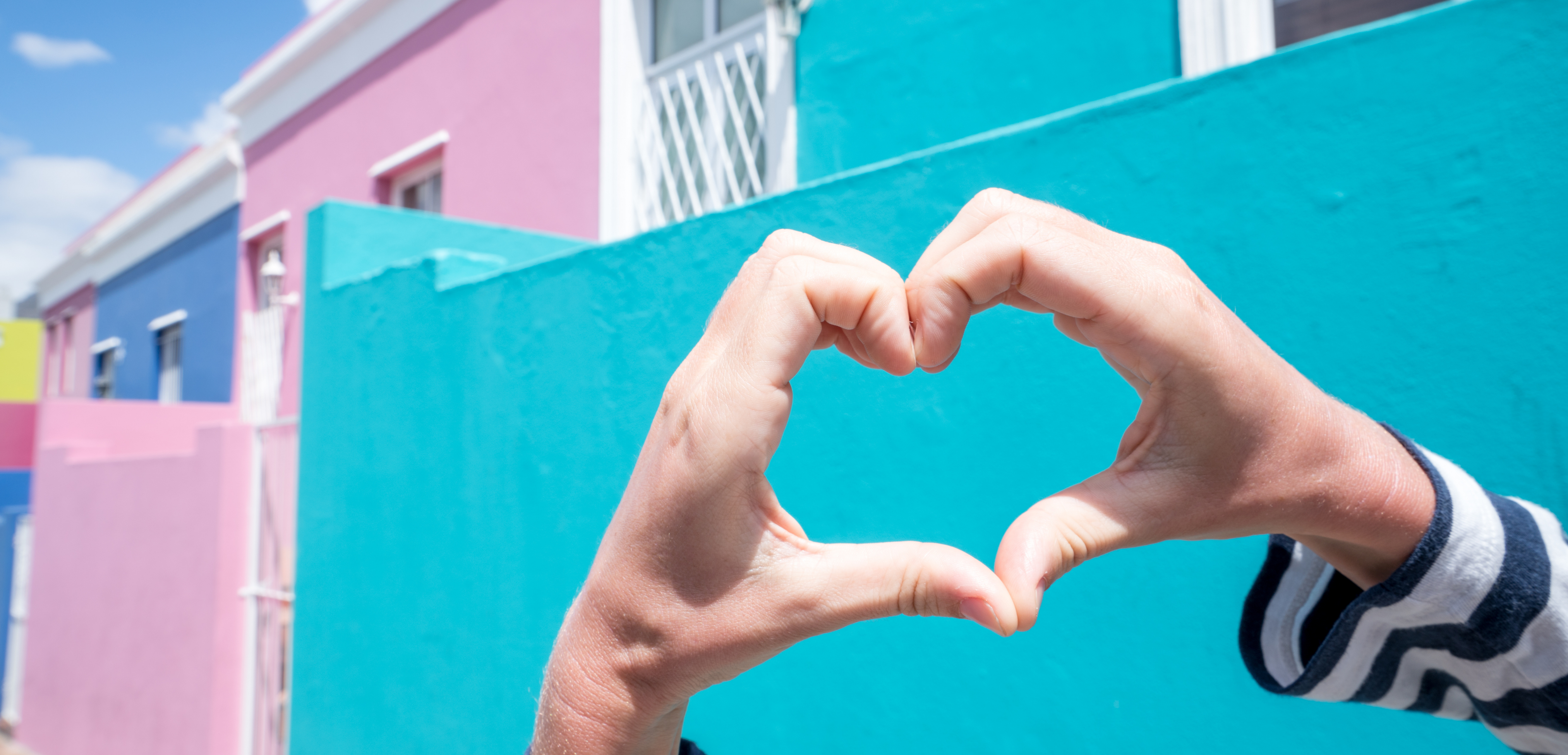 Person making heart shape in The bo-kaap 