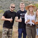 Tourists enjoying a Savanna cider drink at a lookout point in the Addo Elephant National Park on a guided Addo safari tour with Into Tours 