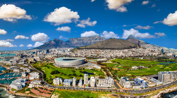 Cape Town's iconic Table Mountain in this breathtaking aerial photograph. The city bowl and the Mother City spread out beneath the majestic Table mountain, their vibrant colors and architectural diversity beautifully juxtaposed against the natural wonder. Cape Town's iconic Table Mountain in this breathtaking aerial photograph. The city bowl and the Mother City spread out beneath the majestic Table mountain, their vibrant colors and architectural diversity beautifully juxtaposed against the natural wonder.