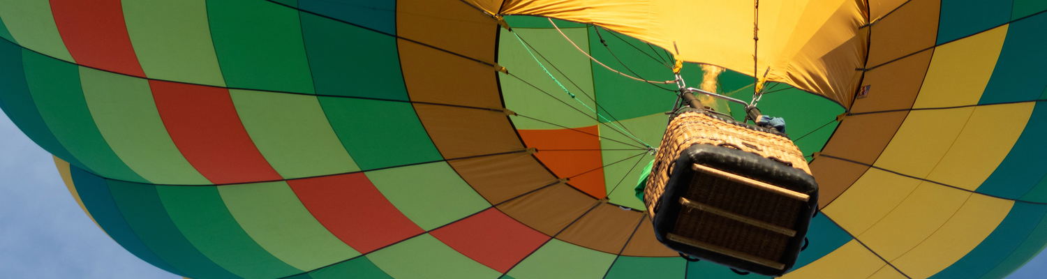 Hot-air Balloon taking off in flight over the Cape Winelands