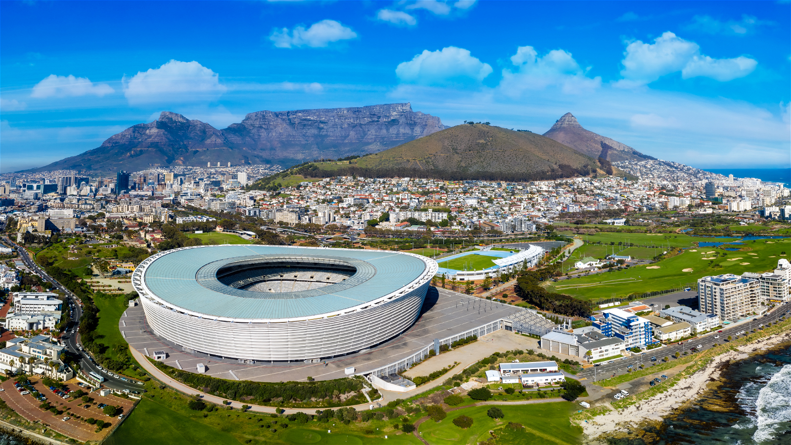Arial view of Cape Towns city bowl, on a clear and hot summers day with Signal Hill, Table Mountain and soccer stadium in the background