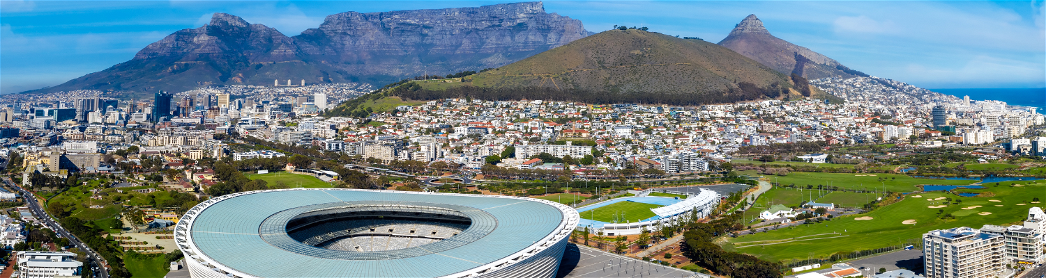 Arial view of Cape Towns city bowl, on a clear and hot summers day with Signal Hill, Table Mountain and soccer stadium in the background
