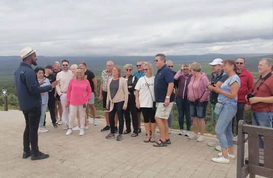 Group photos with laughing and happy guests and enjoying the scenic safari route.